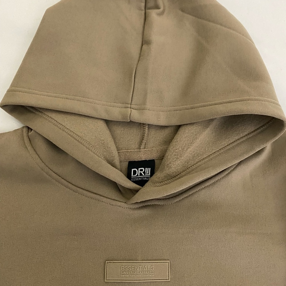 Brand new khaki DR Essentials hoodie 
Size L and XL are available